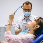 a woman is getting dental treatment