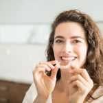 a woman is getting invisalign