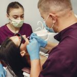 a woman is getting dental implant treatment